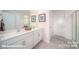 Modern bathroom with dual sinks, white cabinetry, and a clean, contemporary design at 3868 Maxwell Henry Nw Ln, Conover, NC 28613