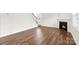 Open living area with hardwood floors, fireplace, and plenty of natural light at 3868 Maxwell Henry Nw Ln, Conover, NC 28613
