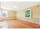 Bright bedroom featuring hardwood floors, fresh paint, and natural light from multiple windows at 415 Princeton Dr, Salisbury, NC 28144