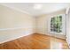 Bright bedroom with hardwood floors, chair rail, and natural light at 415 Princeton Dr, Salisbury, NC 28144