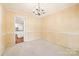Dining room with a chandelier, light walls, and a view of the kitchen at 415 Princeton Dr, Salisbury, NC 28144