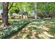 Traditional home with a well-kept lawn, mature trees, and green accents at 415 Princeton Dr, Salisbury, NC 28144