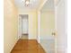 Bright hallway with hardwood floors transitioning to carpeted area, and neutral wall color at 415 Princeton Dr, Salisbury, NC 28144