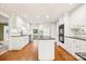 Bright kitchen with white cabinets, black countertops, island, and stainless steel appliances at 415 Princeton Dr, Salisbury, NC 28144