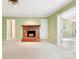Living room featuring a brick fireplace and neutral carpet at 415 Princeton Dr, Salisbury, NC 28144
