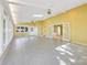 Large, sunlit living room with access to another room, and tile floors at 415 Princeton Dr, Salisbury, NC 28144