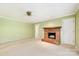 Cozy living room featuring a brick fireplace and neutral carpet at 415 Princeton Dr, Salisbury, NC 28144