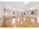 Sun-filled living room with hardwood floors and multiple windows offering ample natural light at 415 Princeton Dr, Salisbury, NC 28144