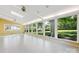 Bright sunroom with large windows overlooking lush backyard and tile floors at 415 Princeton Dr, Salisbury, NC 28144
