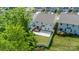 Aerial view of a backyard featuring deck, patio, fenced yard and green grass at 424 Preston Rd, Mooresville, NC 28117