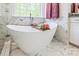 Luxurious bathroom with a freestanding tub, marble accents, and elegant fixtures at 424 Preston Rd, Mooresville, NC 28117