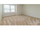 Bedroom with carpeting, bright natural light, and fresh paint at 424 Preston Rd, Mooresville, NC 28117