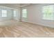 Spacious bedroom featuring neutral carpet, natural light from three windows, and an open layout at 424 Preston Rd, Mooresville, NC 28117
