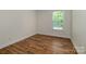 Bedroom featuring hardwood floors and a window providing natural light at 424 Preston Rd, Mooresville, NC 28117