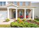 A brick home featuring a front porch with rocking chairs, offers a cozy and welcoming curb appeal at 424 Preston Rd, Mooresville, NC 28117