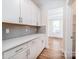Beautiful white cabinets with quartz countertops and gray subway tile backsplash at 424 Preston Rd, Mooresville, NC 28117