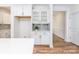 Kitchen featuring white cabinetry, quartz countertops and hardwood floors at 424 Preston Rd, Mooresville, NC 28117