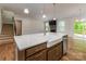 Spacious kitchen island that overlooks the living room with hardwood floors and stainless steel appliances at 424 Preston Rd, Mooresville, NC 28117