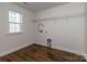 Functional laundry room with wood-look tile flooring, a window and convenient utility connections at 424 Preston Rd, Mooresville, NC 28117