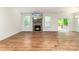 Bright living room with fireplace, mounted TV, and sliding glass doors to a deck at 424 Preston Rd, Mooresville, NC 28117