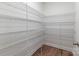 Spacious pantry featuring custom wire shelving and durable wood-look flooring at 424 Preston Rd, Mooresville, NC 28117
