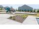A playground offers swings and slides surrounded by woodchips and grass, providing fun recreation at 424 Preston Rd, Mooresville, NC 28117
