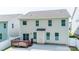 A view of the rear exterior featuring a deck and sliding glass doors at 424 Preston Rd, Mooresville, NC 28117