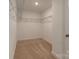 Bright walk-in closet with carpet floors and wire shelving at 424 Preston Rd, Mooresville, NC 28117