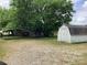 The expansive backyard has a storage shed and room for parking, gardening, and entertaining at 4630 Roberta Rd, Concord, NC 28027