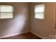 This cozy bedroom has hardwood floors, neutral walls, and plenty of natural light through the windows at 4630 Roberta Rd, Concord, NC 28027