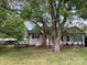 Charming single story home with mature trees and lush green lawn in established neighborhood at 4630 Roberta Rd, Concord, NC 28027
