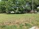 The beautiful green grass in the front yard adds to the charm of the property at 4630 Roberta Rd, Concord, NC 28027