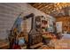 Spacious unfinished basement features lots of open storage and a wood burning stove at 480 S Ingleside Farm Rd, Iron Station, NC 28080
