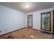 A bright bedroom showcasing the potential for customization with two windows at 480 S Ingleside Farm Rd, Iron Station, NC 28080