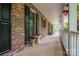 Spacious covered porch with ample room for seating and decor, ideal for enjoying the outdoor scenery at 480 S Ingleside Farm Rd, Iron Station, NC 28080