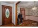Cozy dining room featuring hardwood floors and decorative wallpaper, creating a warm and inviting atmosphere at 480 S Ingleside Farm Rd, Iron Station, NC 28080