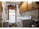 Cozy laundry room features washer, dryer, window and lots of storage space at 480 S Ingleside Farm Rd, Iron Station, NC 28080