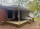 Cozy back patio and porch with access to the yard at 4817 Ridgeley Dr, Charlotte, NC 28208