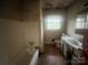 Full bathroom with a tub and shower, and an updated vanity at 4817 Ridgeley Dr, Charlotte, NC 28208