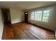 Spacious living room featuring hardwood floors, bright windows, and ample natural light at 4817 Ridgeley Dr, Charlotte, NC 28208