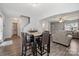 Bright dining area with table, chairs, and chandelier adjacent to living room and kitchen, great for gathering at 509 Ellingsworth Ln, Charlotte, NC 28214