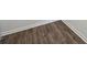 View of new wood-look flooring with white base trim at 509 Ellingsworth Ln, Charlotte, NC 28214