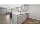Modern kitchen featuring white cabinets, stainless steel appliances, and quartz countertops, offering a sleek space at 509 Ellingsworth Ln, Charlotte, NC 28214