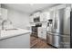 Contemporary kitchen with stainless steel fridge and oven, and modern countertops at 509 Ellingsworth Ln, Charlotte, NC 28214