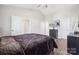 Comfortable main bedroom has ceiling fan, an ensuite entrance, and luxury mattress at 509 Ellingsworth Ln, Charlotte, NC 28214
