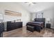 Spacious main bedroom features a ceiling fan, a large window, and wood-look floors at 509 Ellingsworth Ln, Charlotte, NC 28214