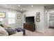 Relaxing bonus room with a sofa, TV, storage cabinet, and convenient laundry room access at 5216 Mccallum Meadows Dr, Charlotte, NC 28216