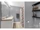 Elegant bathroom featuring double sinks, a large mirror, and a shower with a curtain, offering functionality at 522 Kittiewake Ln, Clover, SC 29710