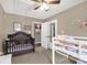 Cozy bedroom featuring carpeted floors, closet space, and comfortable sleeping spaces at 522 Kittiewake Ln, Clover, SC 29710