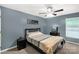 Comfortable bedroom featuring soft carpet, a ceiling fan, and a relaxing reading space, perfect for unwinding at 522 Kittiewake Ln, Clover, SC 29710